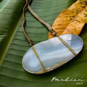 Statement long necklace with big stone.